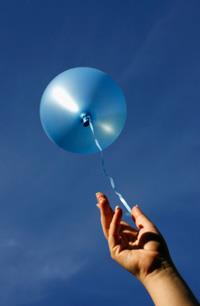 Blue Balloon / streamer/ hand / blue sky
